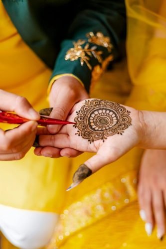 Detailed henna design being applied on a hand in Kathmandu, Nepal, showcasing traditional artistry.